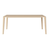 Light beige rectangular dining table with a smooth, minimalist design and straight legs. No patterns.