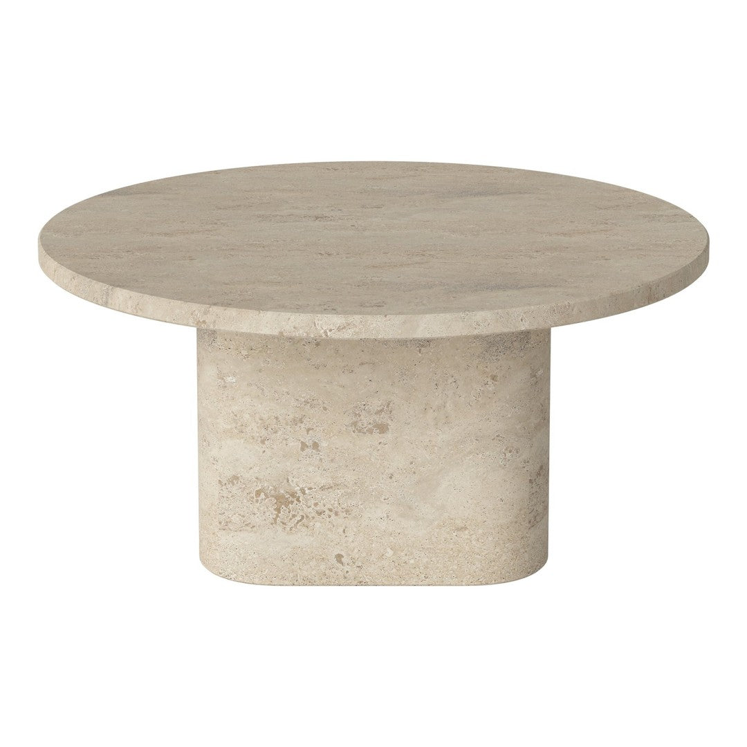 Round beige stone coffee table with a smooth surface and cylindrical base, showcasing a minimalist design.