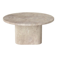 Round beige travertine table with a smooth, matte finish and subtle natural patterns. Ideal for modern decor.