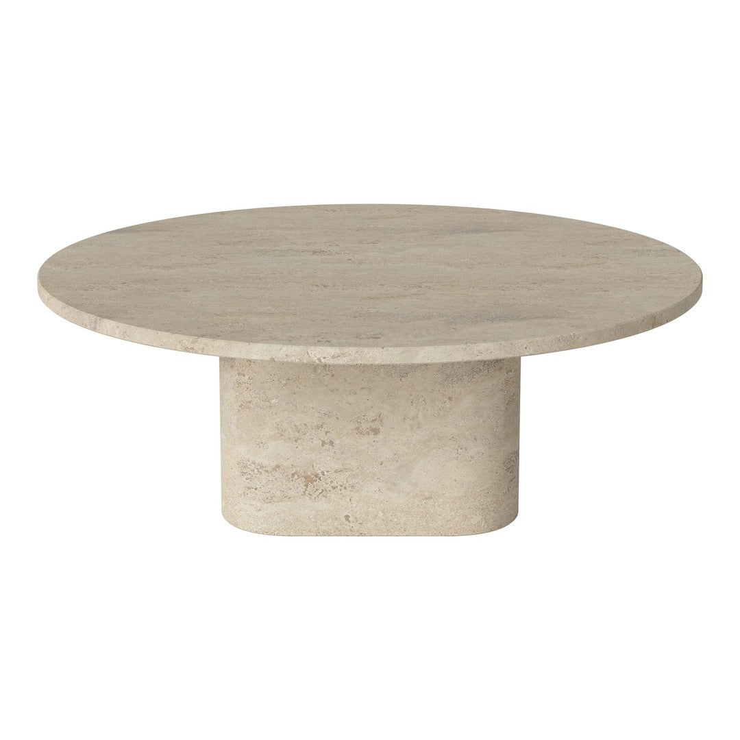Round beige coffee table with a smooth textured surface and cylindrical base. Modern minimalist design.