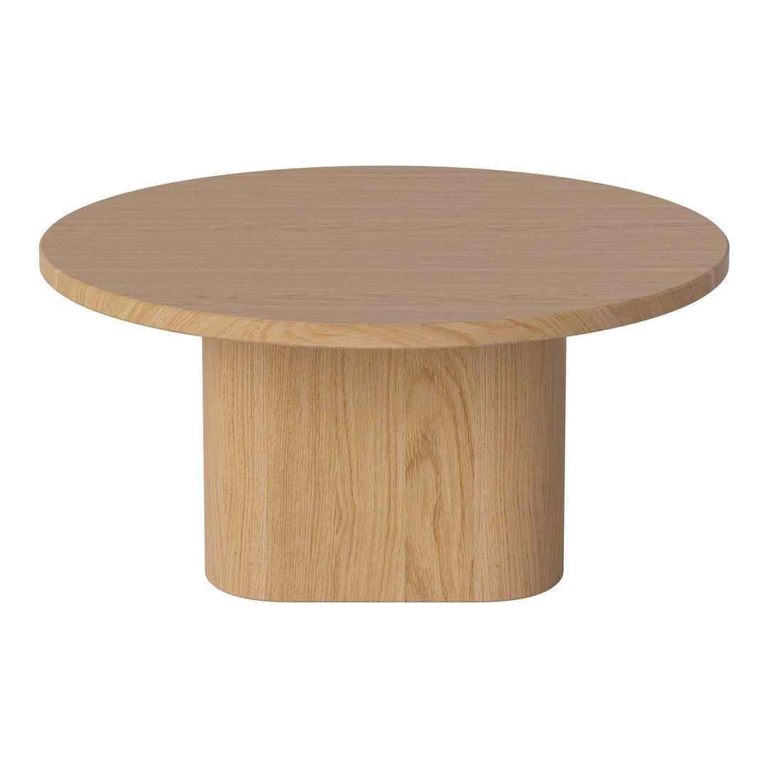 Round light wood coffee table with a smooth, natural grain pattern and cylindrical base.