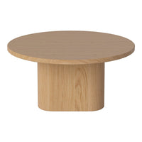 Round light wood coffee table with a smooth, natural grain pattern and cylindrical base.