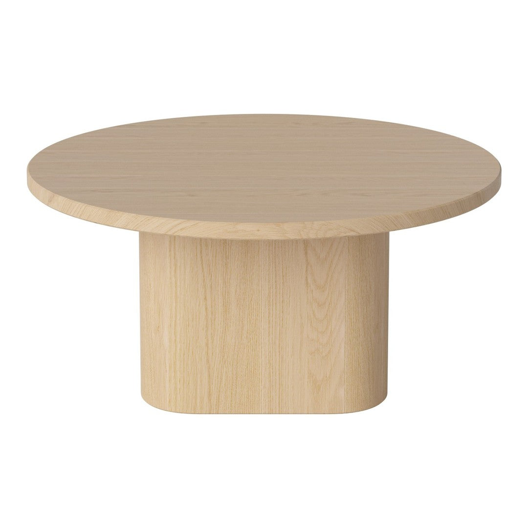 Round light wood coffee table with a smooth surface and minimalist design, featuring a cylindrical base.