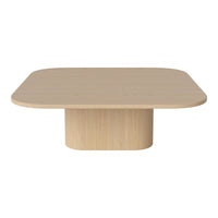 Light wooden coffee table with a smooth, rounded top and a cylindrical base, featuring a natural wood grain pattern.