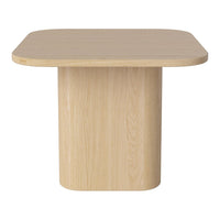 Light beige wooden table with a smooth, minimalist design and rounded edges, perfect for modern decor.