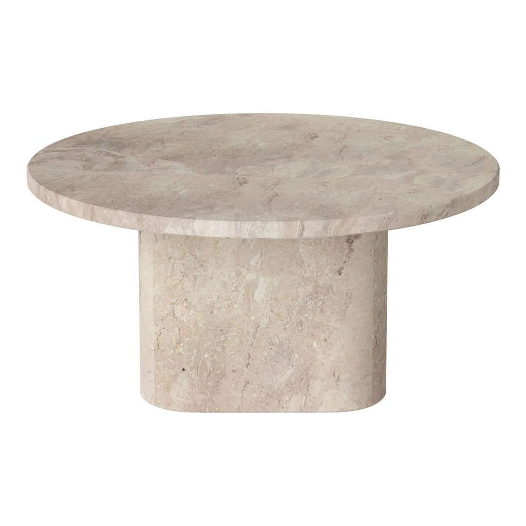 Round beige marble coffee table with a smooth surface and solid cylindrical base.