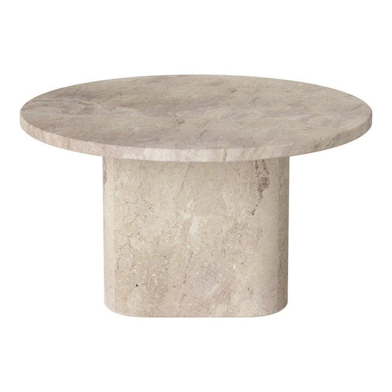Round beige stone table with a smooth surface and solid cylindrical base, showcasing a natural texture.