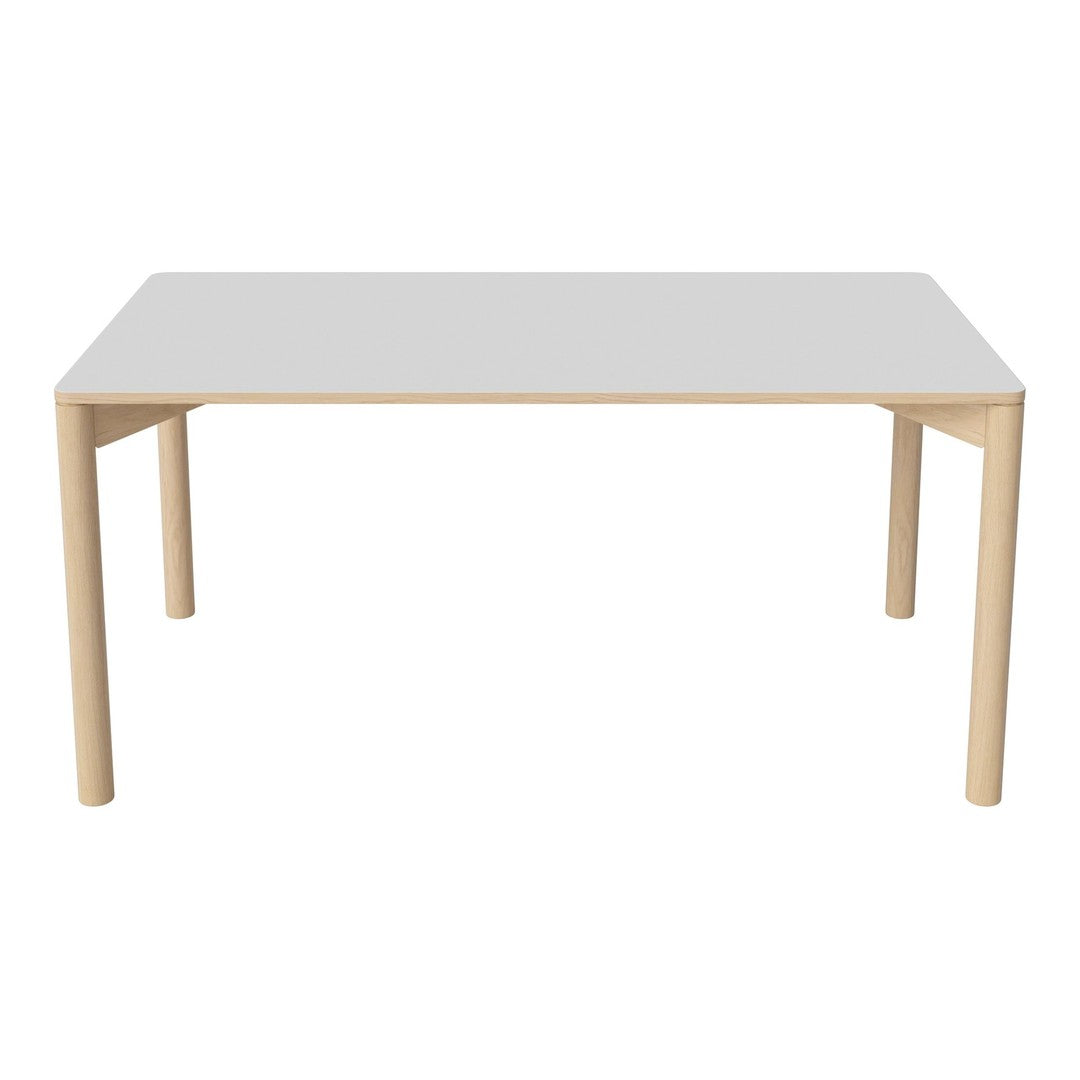White tabletop with light wood legs, featuring a sleek, modern design and minimalistic aesthetic.