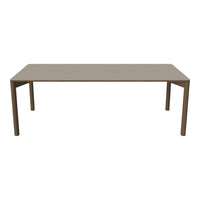 "Simple rectangular dining table in a sleek taupe finish with smooth, solid surface and clean lines."