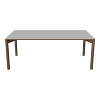 Grey rectangular table with a sleek, minimalist design and brown legs, perfect for modern dining spaces.