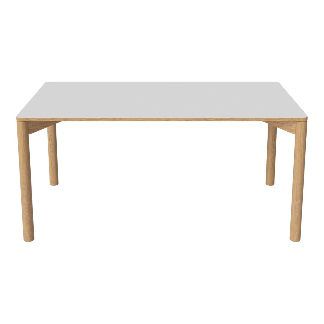 Modern white tabletop with natural wood legs, featuring a minimalist design and clean lines for contemporary decor.
