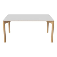 Modern white tabletop with natural wood legs, featuring a minimalist design and clean lines for contemporary decor.