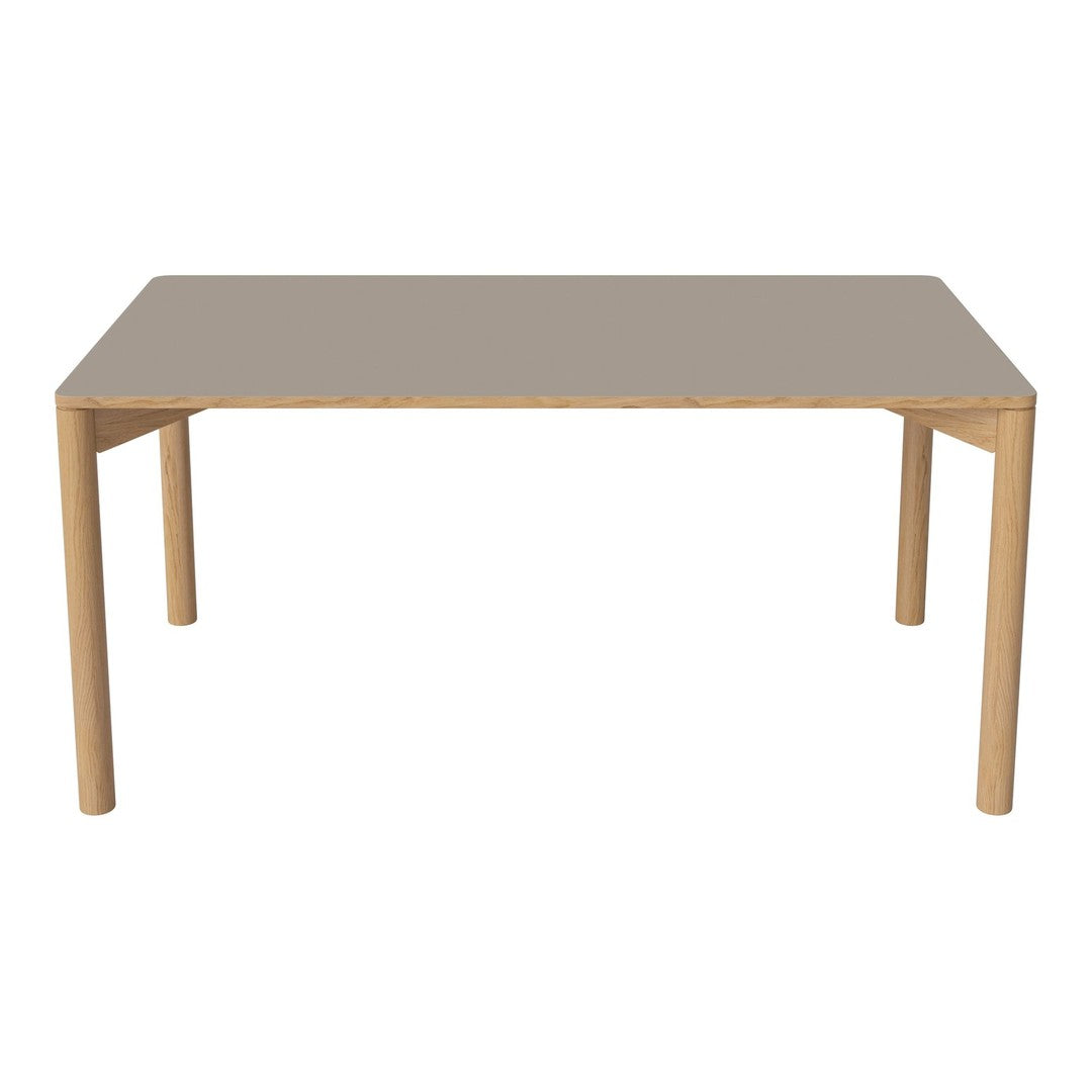 Light wood dining table with a sleek, smooth gray surface and minimalist design. Ideal for modern interiors.