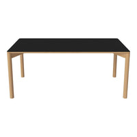 Black rectangular table with light wood legs, featuring a minimalist design and smooth surface. Perfect for modern decor.