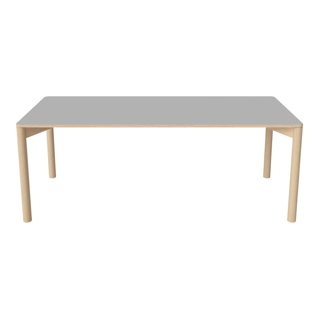 Gray tabletop with natural wooden legs, featuring a minimalist design and smooth surface. Perfect for modern decor.