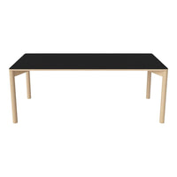 Black tabletop with natural wood legs; modern design complements various decor styles.