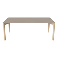 Modern beige rectangular table with sleek, minimalistic design and light wooden legs. Perfect for any dining space.