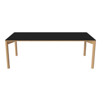Black tabletop with natural wood legs, sleek modern design, perfect for contemporary dining spaces.