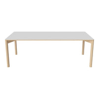 Minimalist white tabletop with natural wood legs, ideal for a modern dining or workspace setting.
