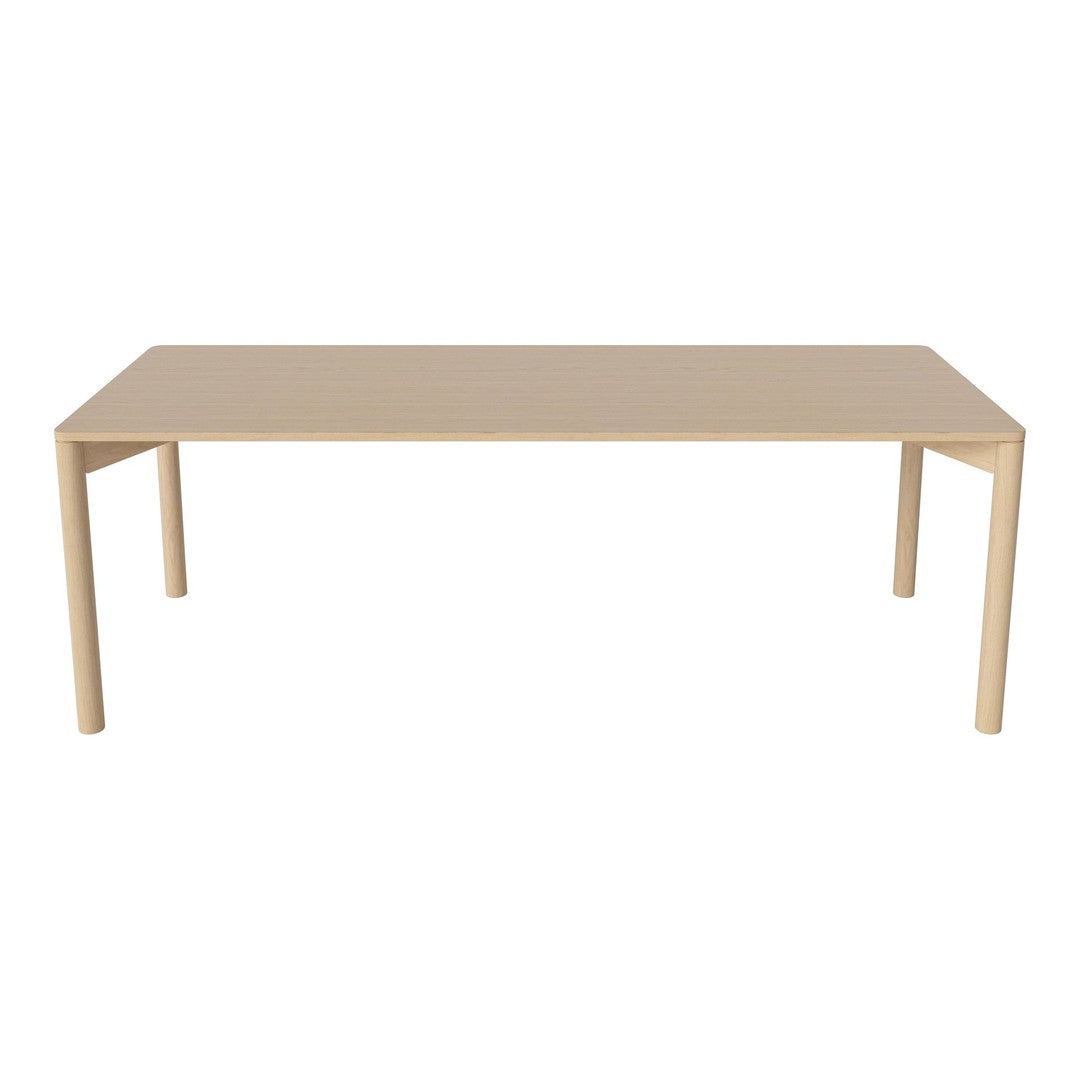 Beige rectangular table with sleek design and smooth surface, perfect for modern decor.