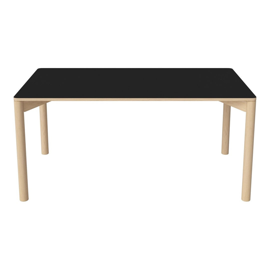 "Modern rectangular dining table with a sleek black top and natural wood legs, showcasing a minimalist design."
