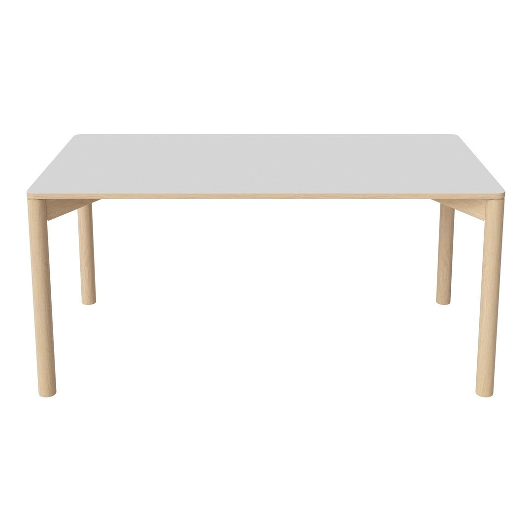 "Modern white table with natural wood legs, featuring a sleek, minimalist design and smooth surface."