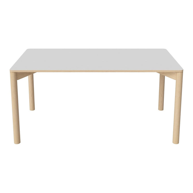 "Modern white table with natural wood legs, featuring a sleek, minimalist design and smooth surface."