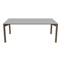 Grey rectangular dining table with a sleek, minimalist design and sturdy brown legs, perfect for modern interiors.