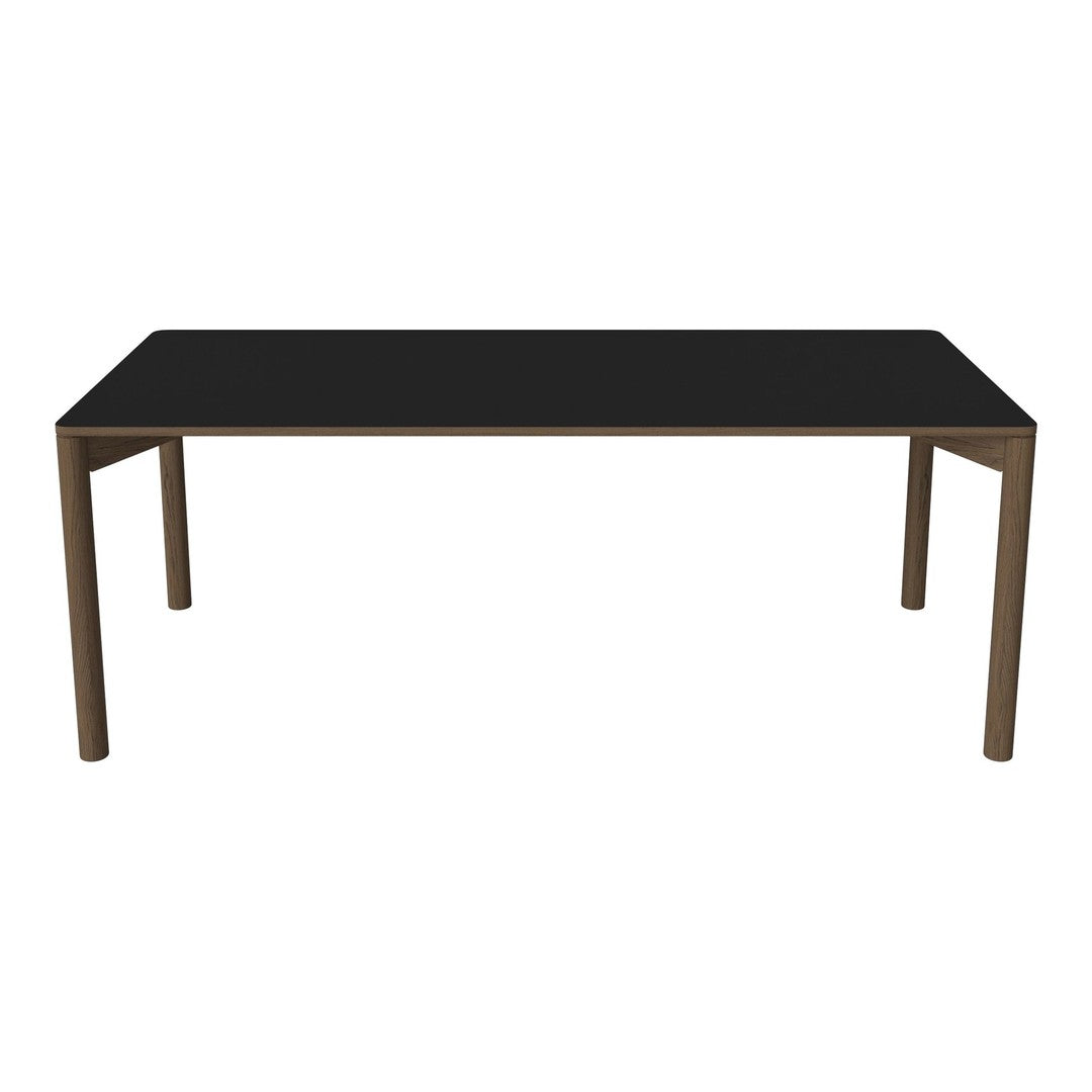 Black rectangular table with sleek, minimalist design and bronze metal legs. Perfect for modern decor.