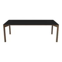 Black rectangular table with a sleek, minimalistic design and wood-tone legs, perfect for modern decor.