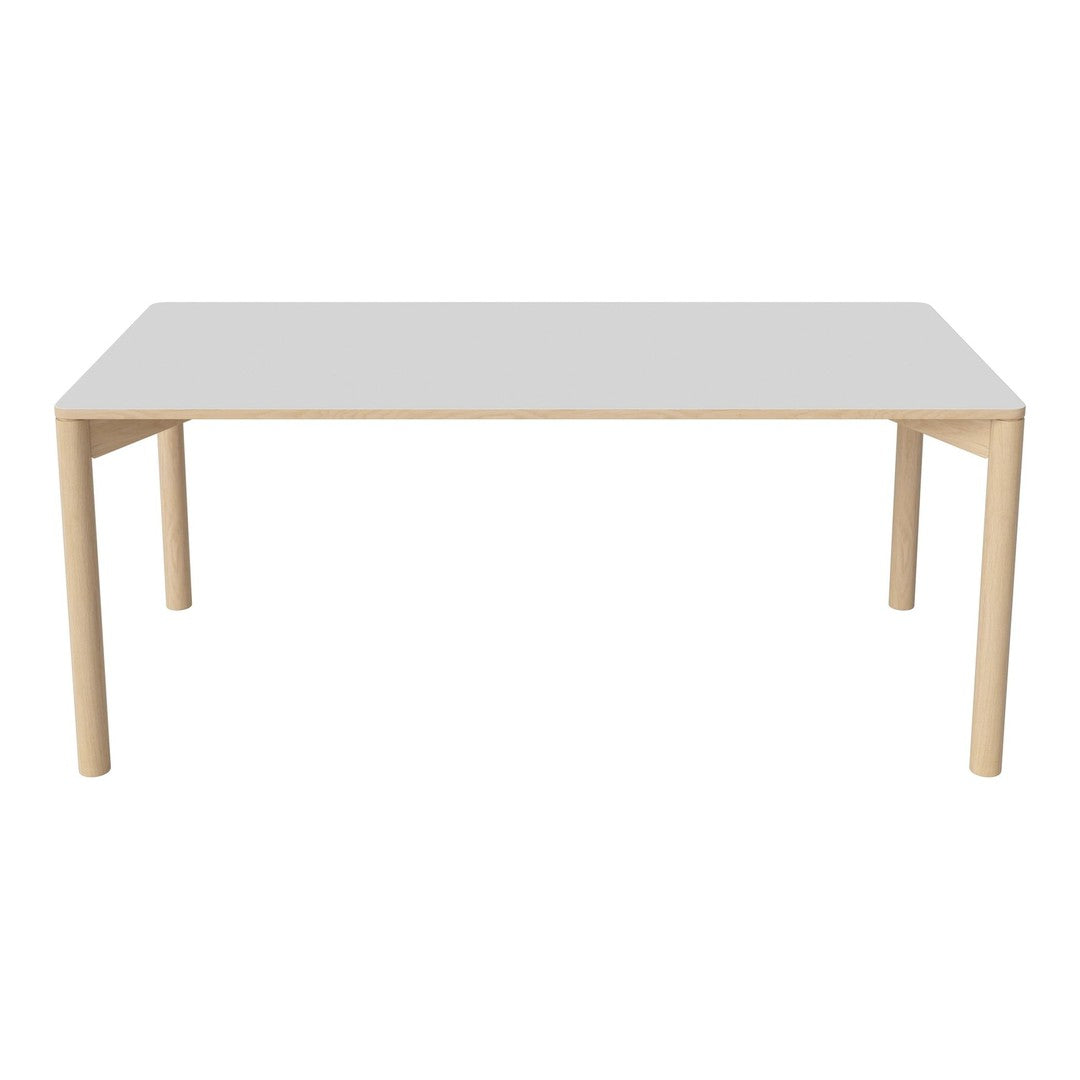 Minimalist white tabletop with natural wooden legs, featuring a sleek, modern design.