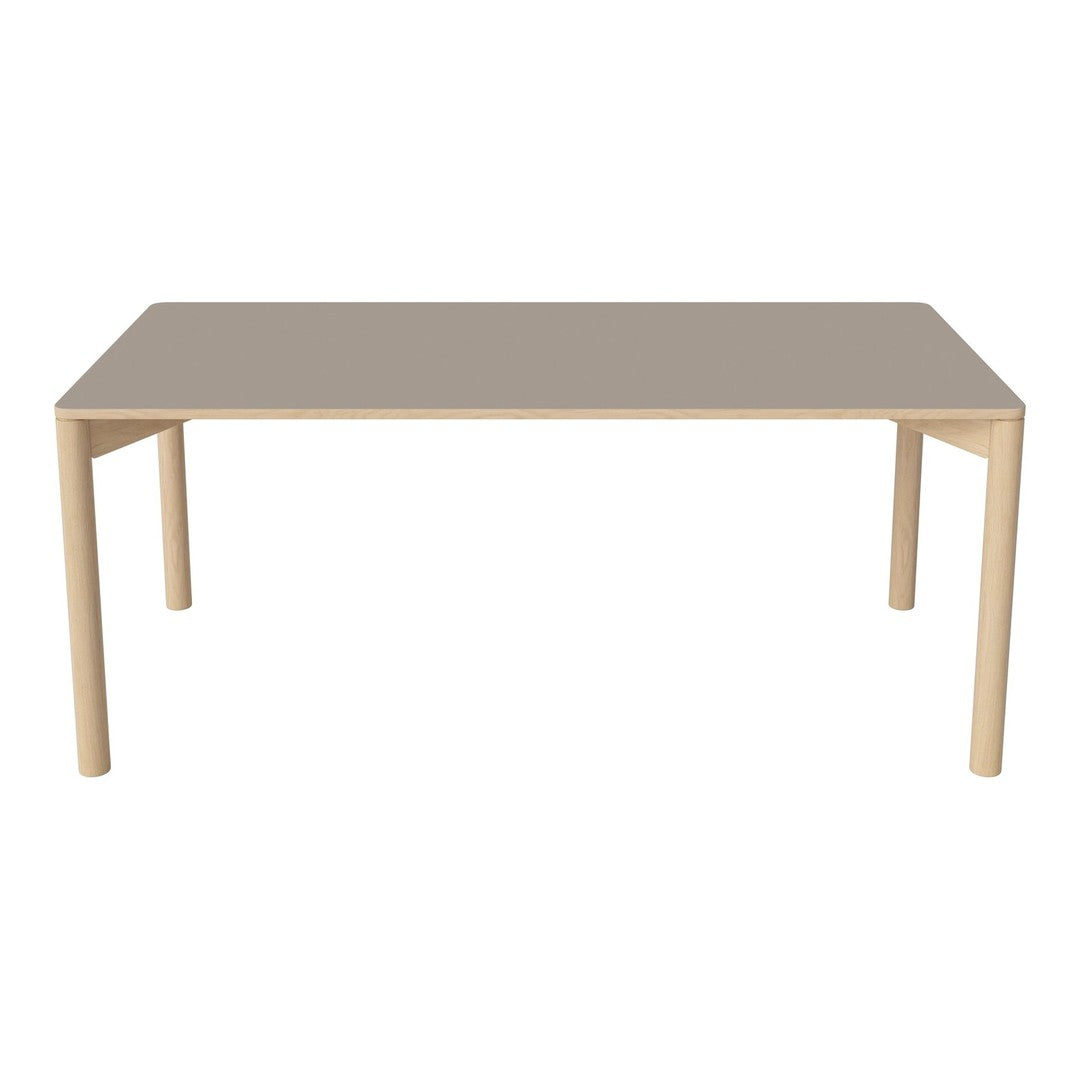 Light beige table with a smooth surface and matching wooden legs, offering a modern and minimalist design.