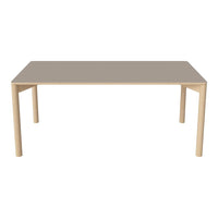 Light beige table with a smooth surface and matching wooden legs, offering a modern and minimalist design.