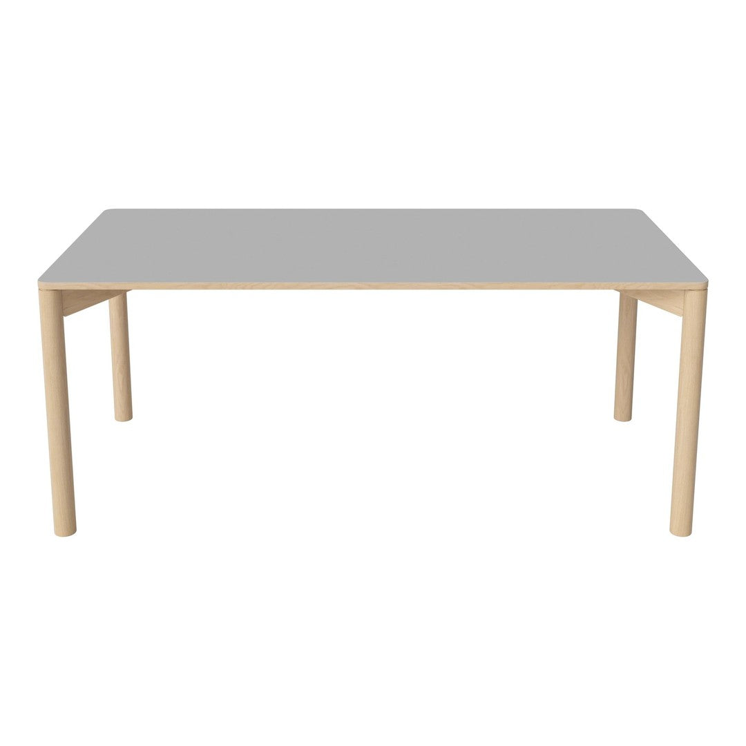 Gray tabletop with a smooth finish and light wooden legs, creating a modern and minimalist aesthetic.