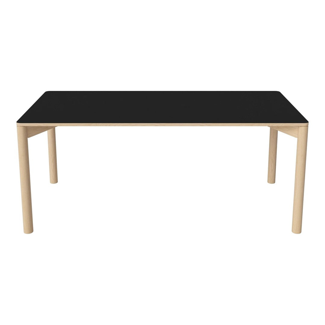 Black tabletop with natural wood legs, showcasing a sleek modern design and minimalist style.