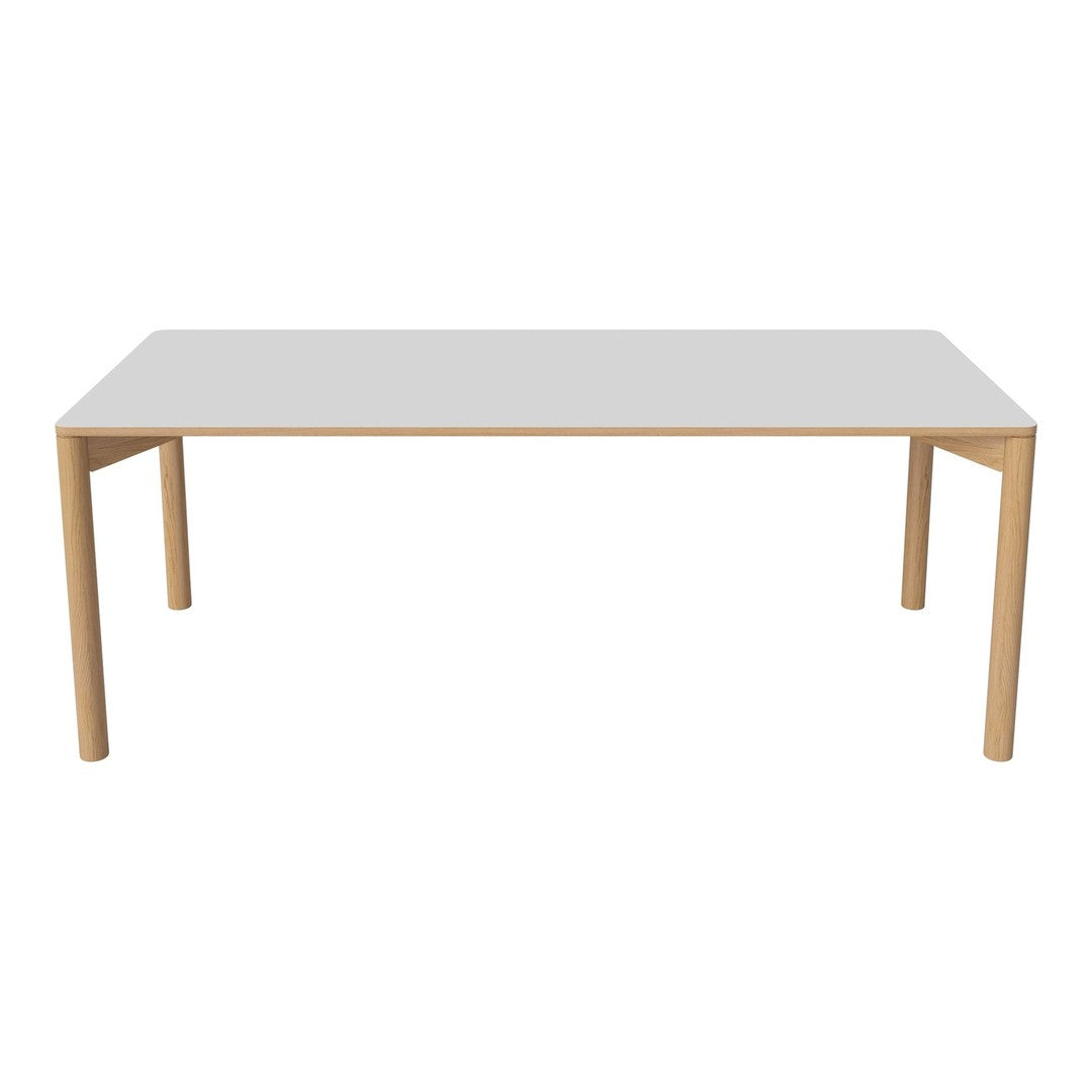 White tabletop with a smooth finish and natural wood legs. Simple, modern design perfect for any space.