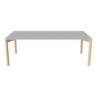 Grey tabletop with natural wood legs, featuring a sleek and minimalistic design perfect for modern decor.