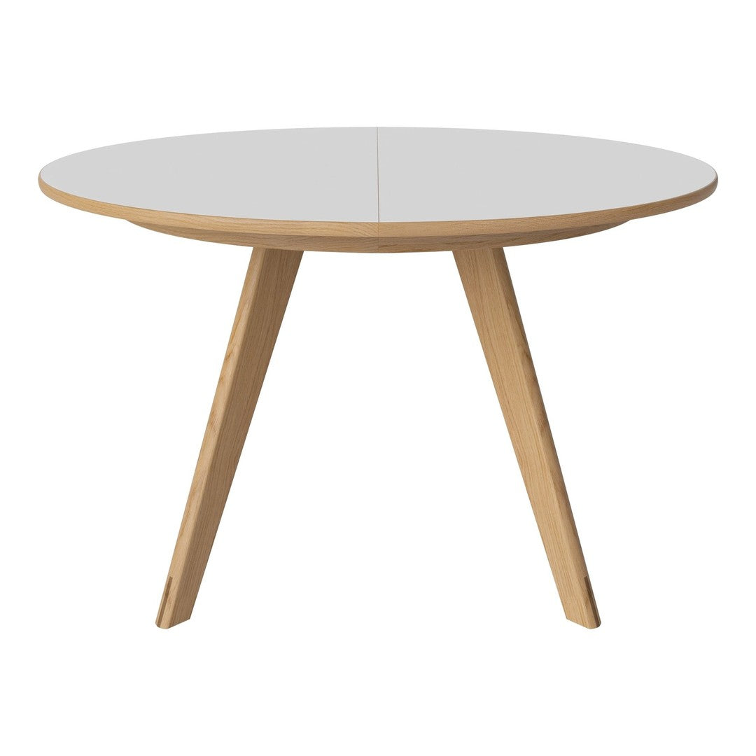 Round white tabletop with natural wood legs, featuring a minimalist design and smooth finish, perfect for modern decor.