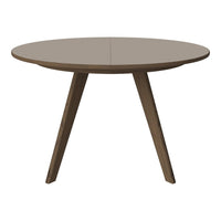 Round beige dining table with a smooth surface and tapered wooden legs, ideal for modern interior designs.