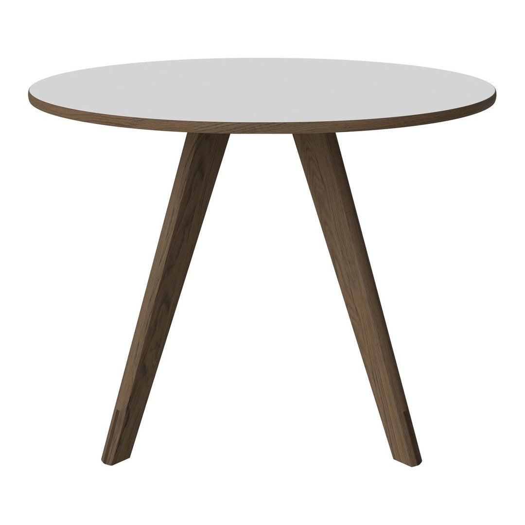 White round tabletop with natural wood legs, showcasing a modern, minimalist design. Perfect for any decor.