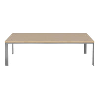 Beige rectangular tabletop with sleek silver metal legs, minimalist design perfect for contemporary spaces.