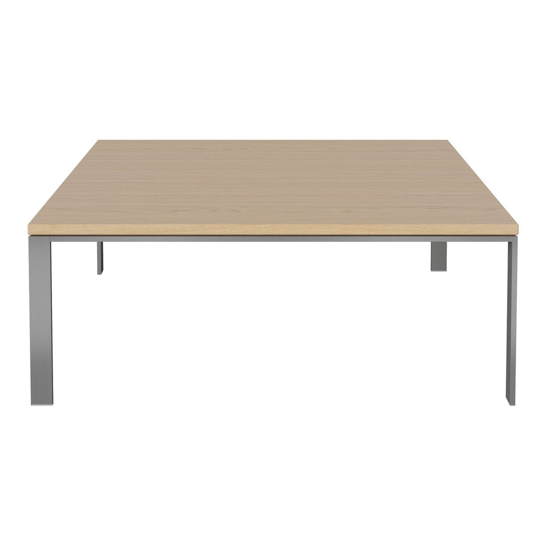 Square table with a smooth light wood top and sleek silver metal legs, showcasing a minimalist design.