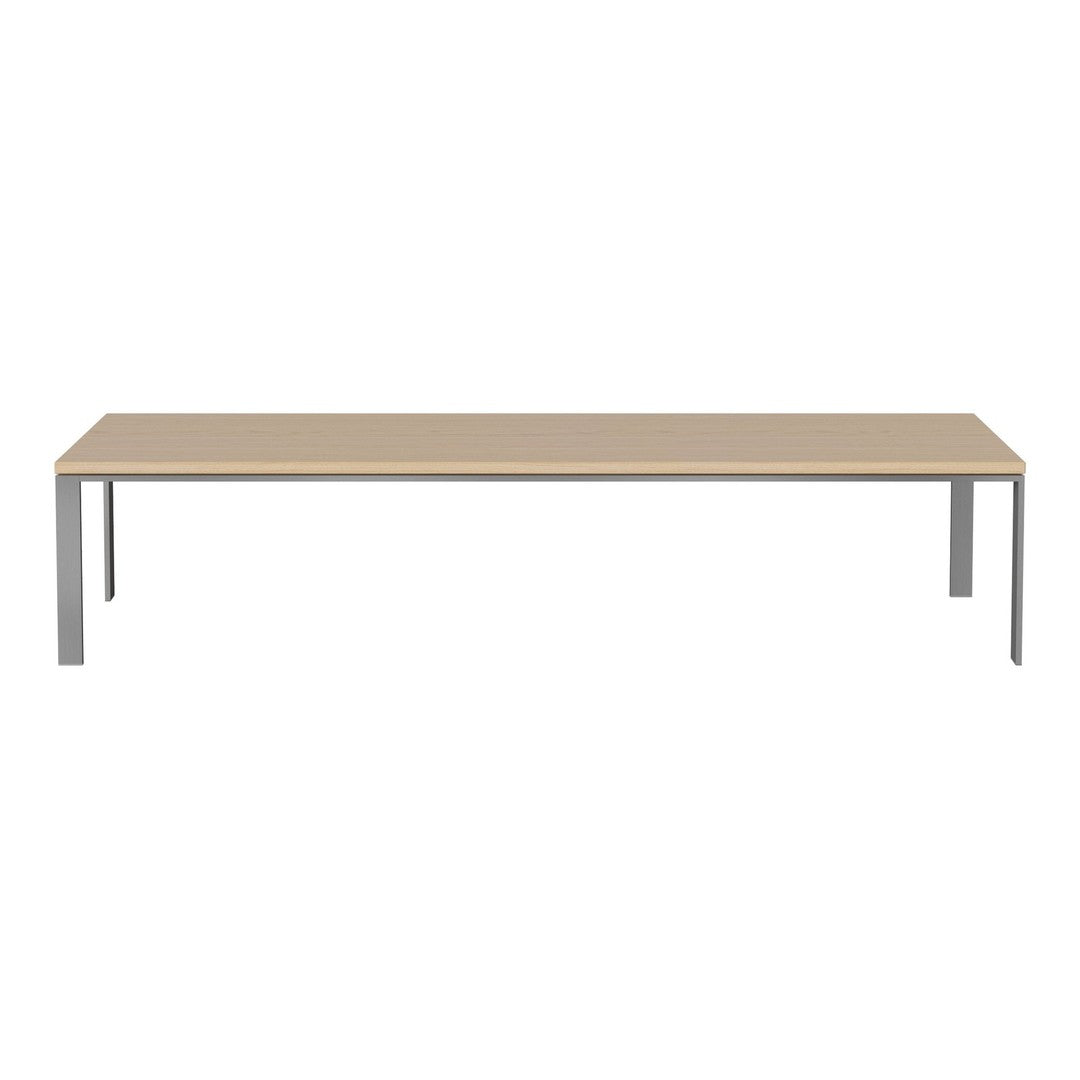 Light beige tabletop with sleek silver metal legs, minimalistic design and smooth finish, perfect for modern spaces.