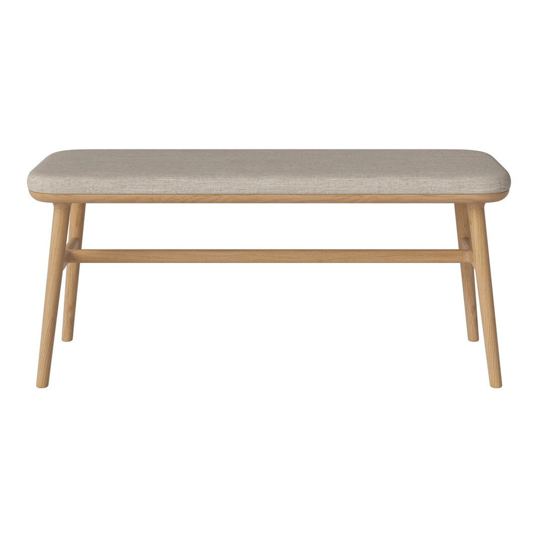 Beige upholstered bench with natural wood legs, featuring a smooth, minimalist design. Perfect for modern interiors.