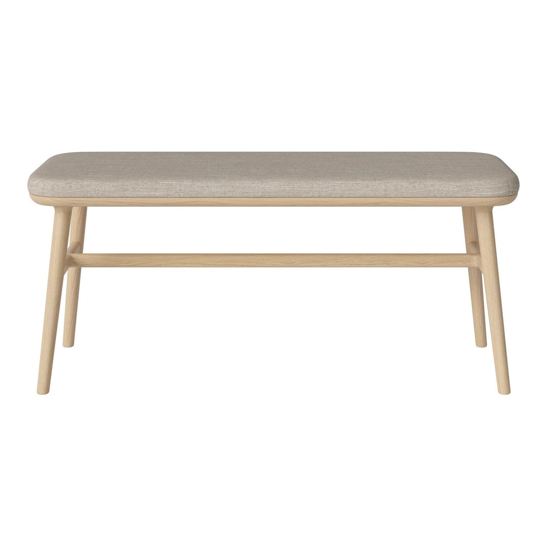 Neutral beige upholstered bench with light wooden legs, featuring a simple, modern design. Perfect for any decor.