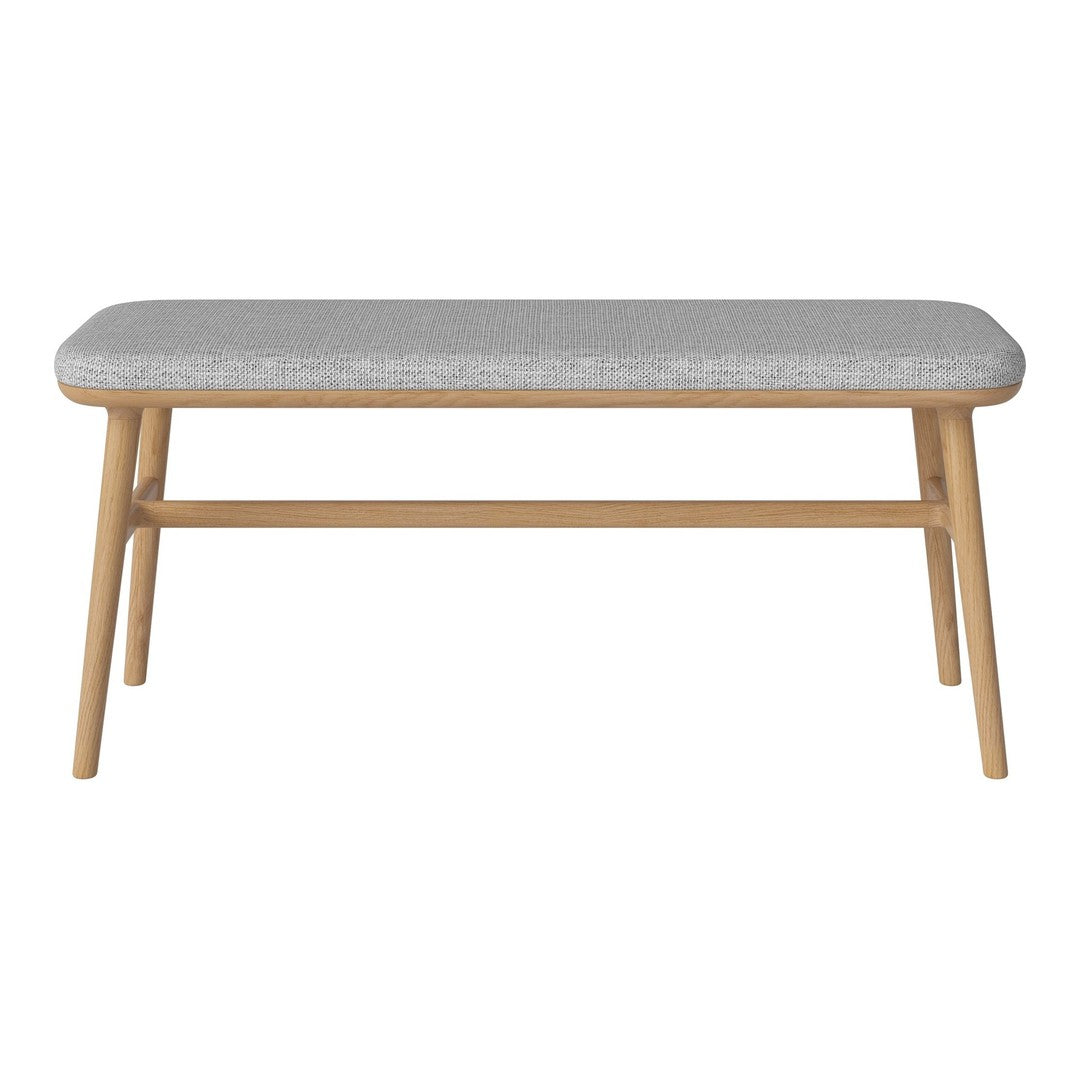 Grey upholstered bench with a smooth surface and natural wood legs, perfect for modern decor.