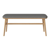 Stylish coffee table with a sleek gray top and warm light wood legs, perfect for modern decor.