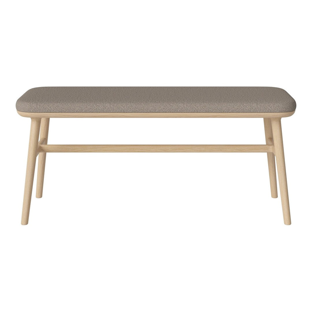 Light wood coffee table with a soft gray upholstered top, featuring a minimalist design. Perfect for modern decor.