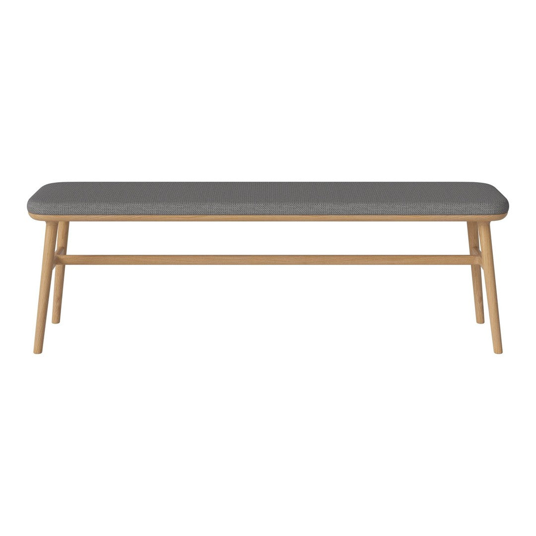 Grey upholstered bench with wooden legs, featuring a sleek, minimalist design and a neutral color palette.