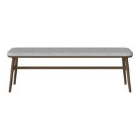 Gray upholstered bench with a sleek wood frame, featuring a minimalist design and subtle texture. Ideal for modern spaces.
